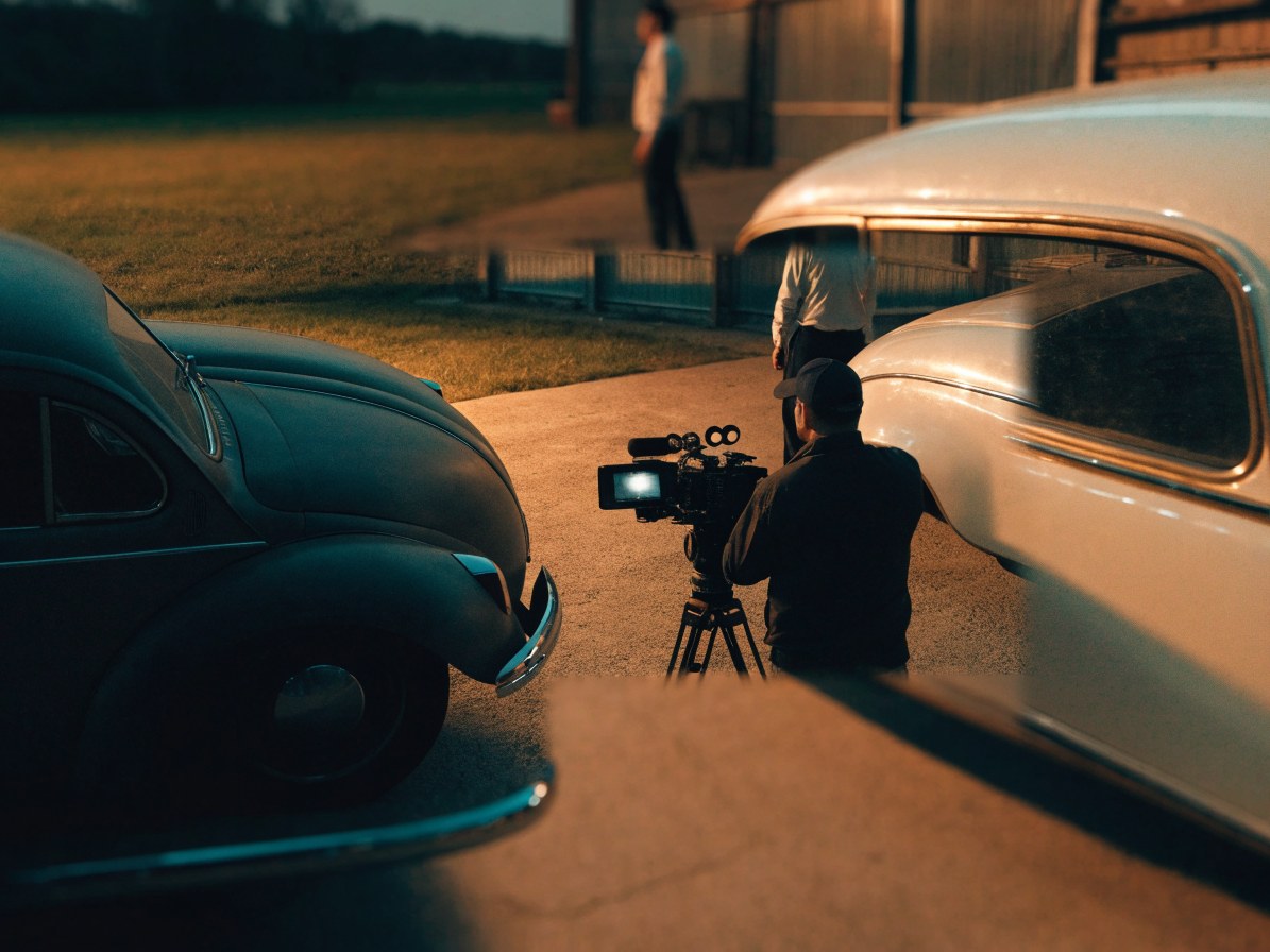 Color grading workstation displaying classic car footage on screen