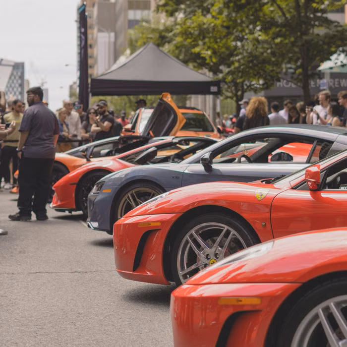 Vintage cars gathered at an outdoor automotive event